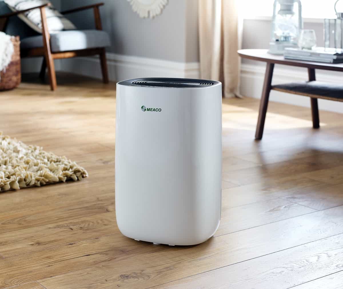 MeacoDry ABC dehumidifier in living room with wooden floor and rugs